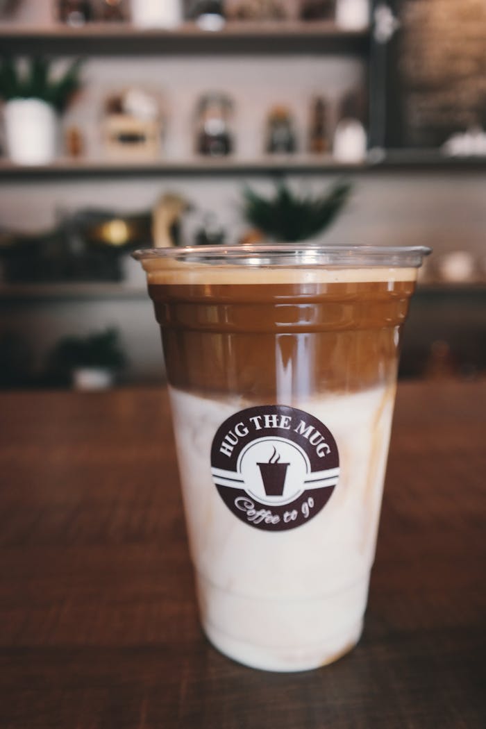 Capturing the Essence: How Java Lords Brings Coffee Origins to Life Close-up of a delicious iced latte in a coffee shop, perfect for morning caffeine boost.